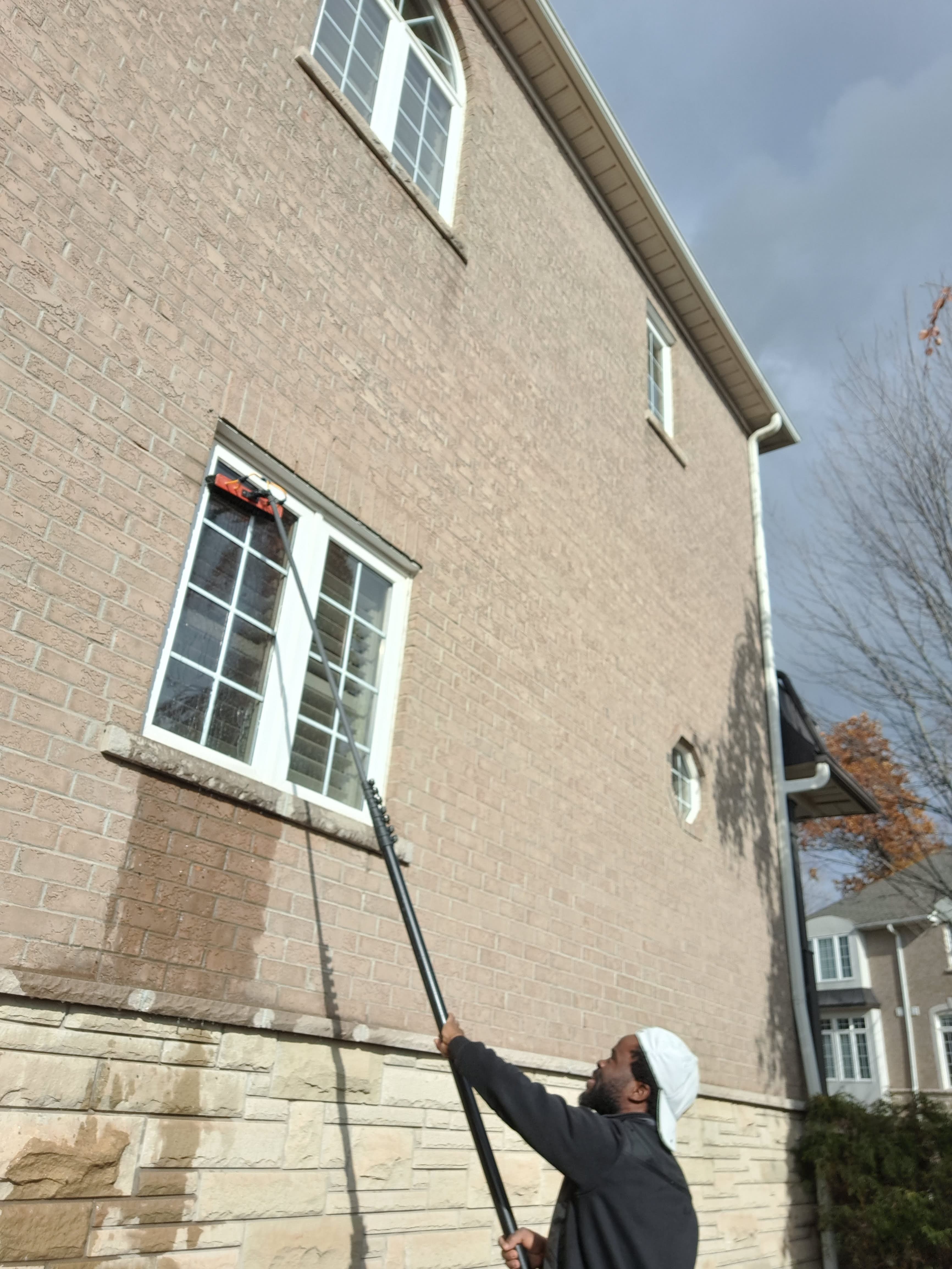 Man cleaning a window